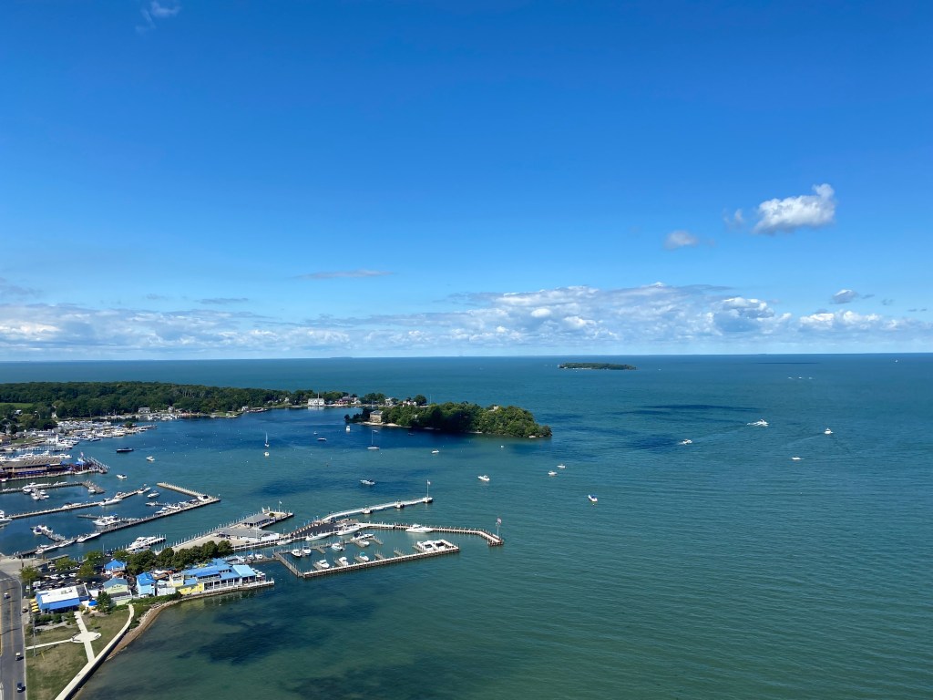 Aerial view of an expansive bay, with boat docks and a small amount of land visible.