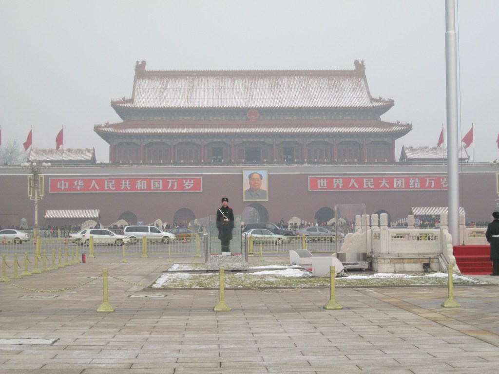 The main tower and gate at Tiananmen Square, covered by a light dusting of snow.