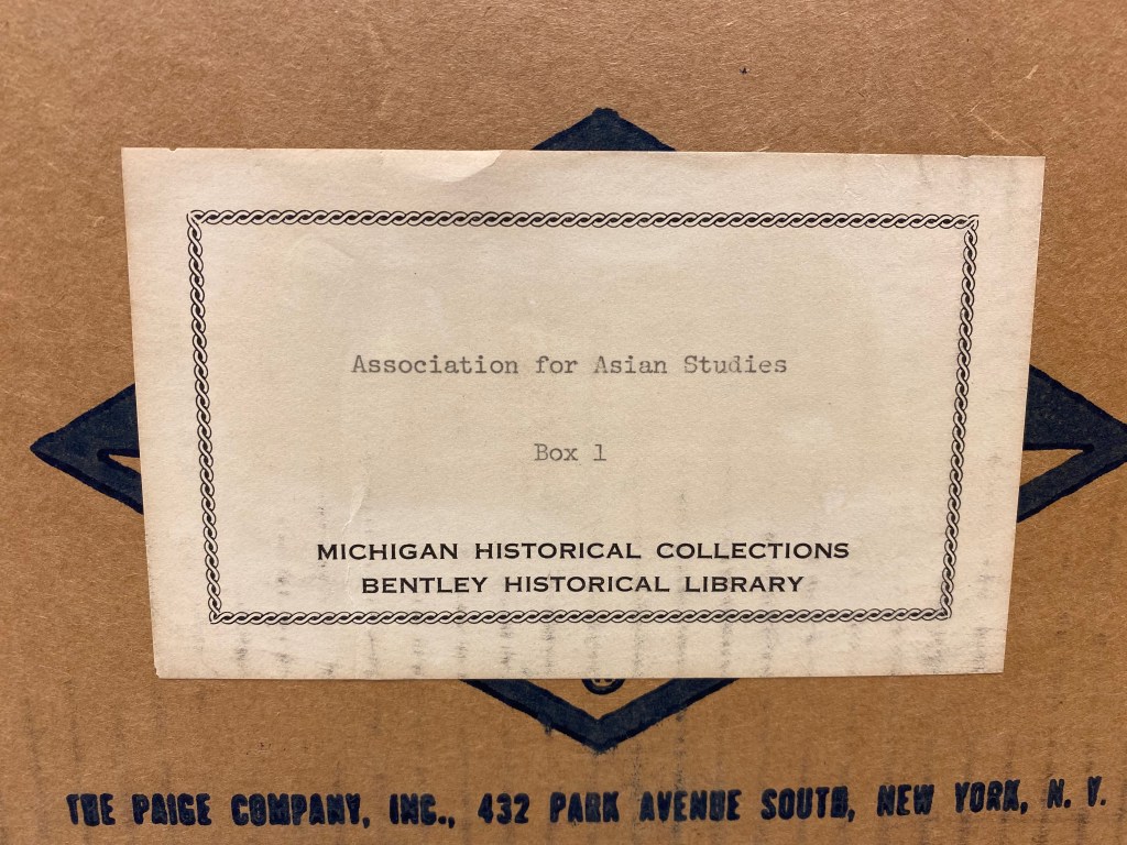 A close-up photograph of an archival box label, reading "Association for Asian Studies, Box 1, Michigan Historical Collections, Bentley Historical Library"